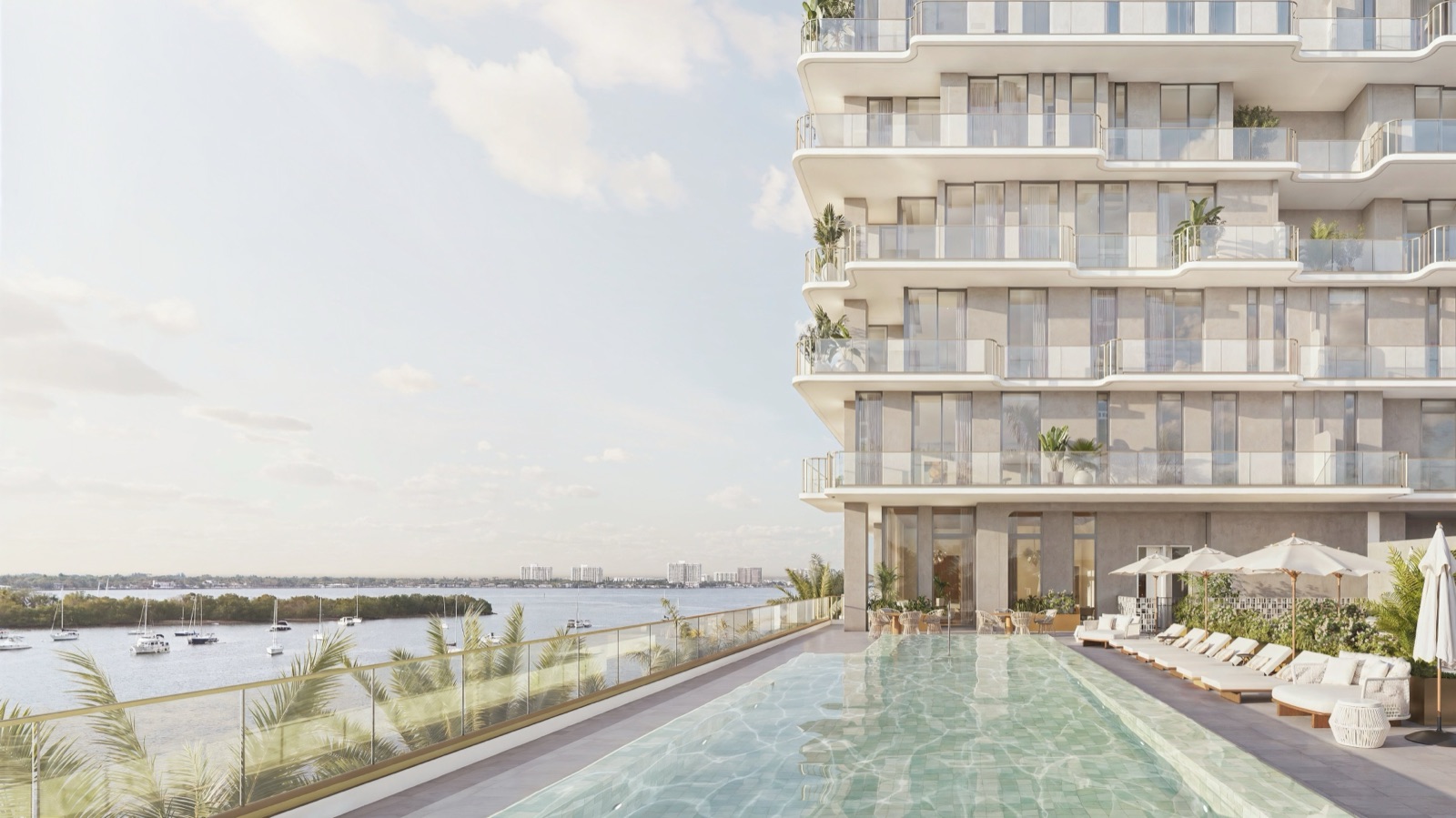 Tula Residences resort-style pool deck with private cabanas overlooking Biscayne Bay.