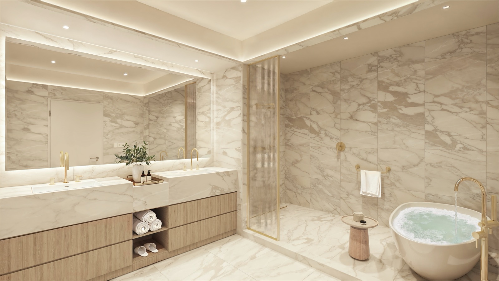Primary bathroom wrapped in sculptural white slabs, fluted glass, champagne metal framing, and a custom vanity by Shannon Farrell Design.